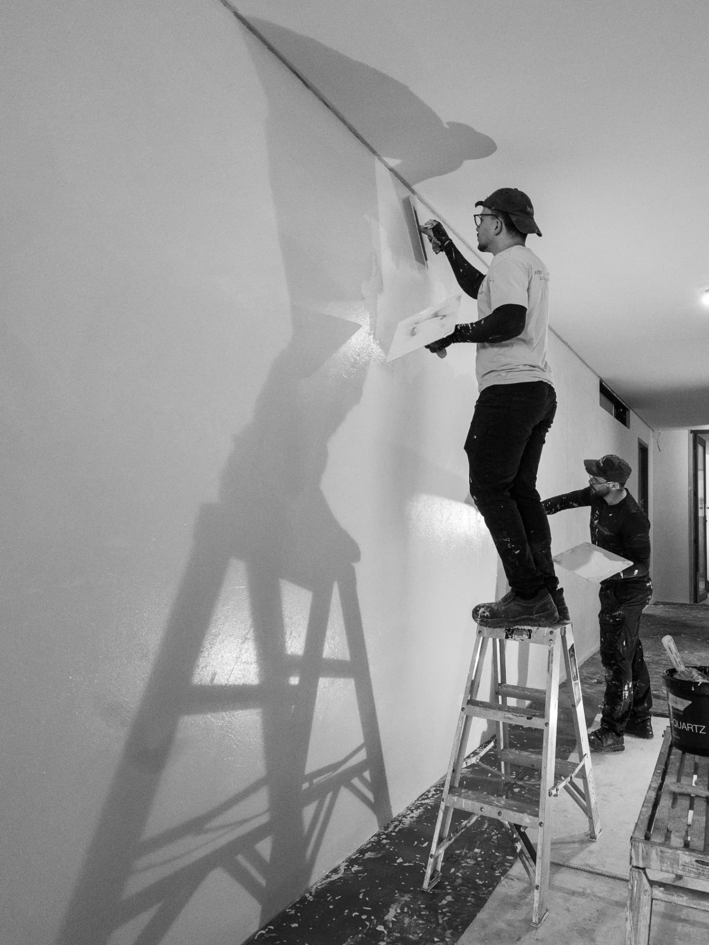 La Casa & Co painters on an interior wall